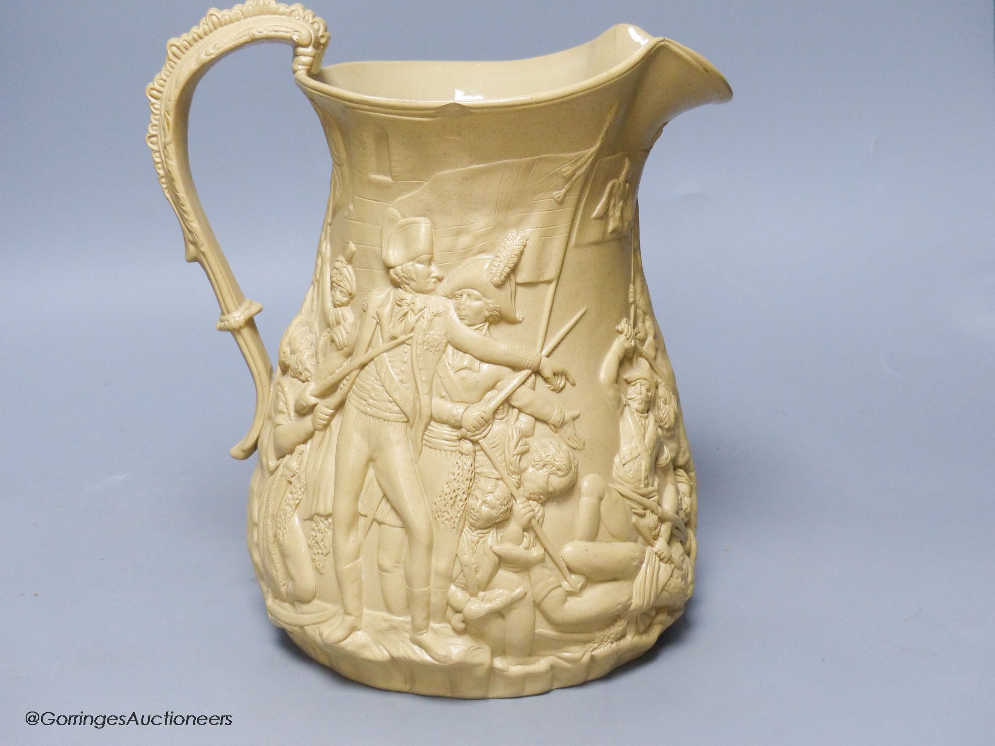 A Victorian relief moulded buff coloured stoneware jug by Samuel Alcock, The Seige of Acre, circa 1850.